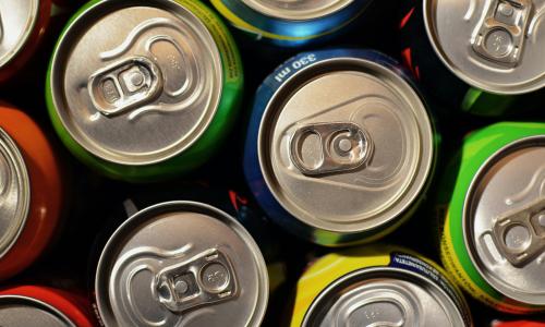 A top down view of soda cans.