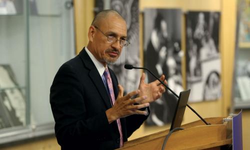 Scientist speaking at a public event