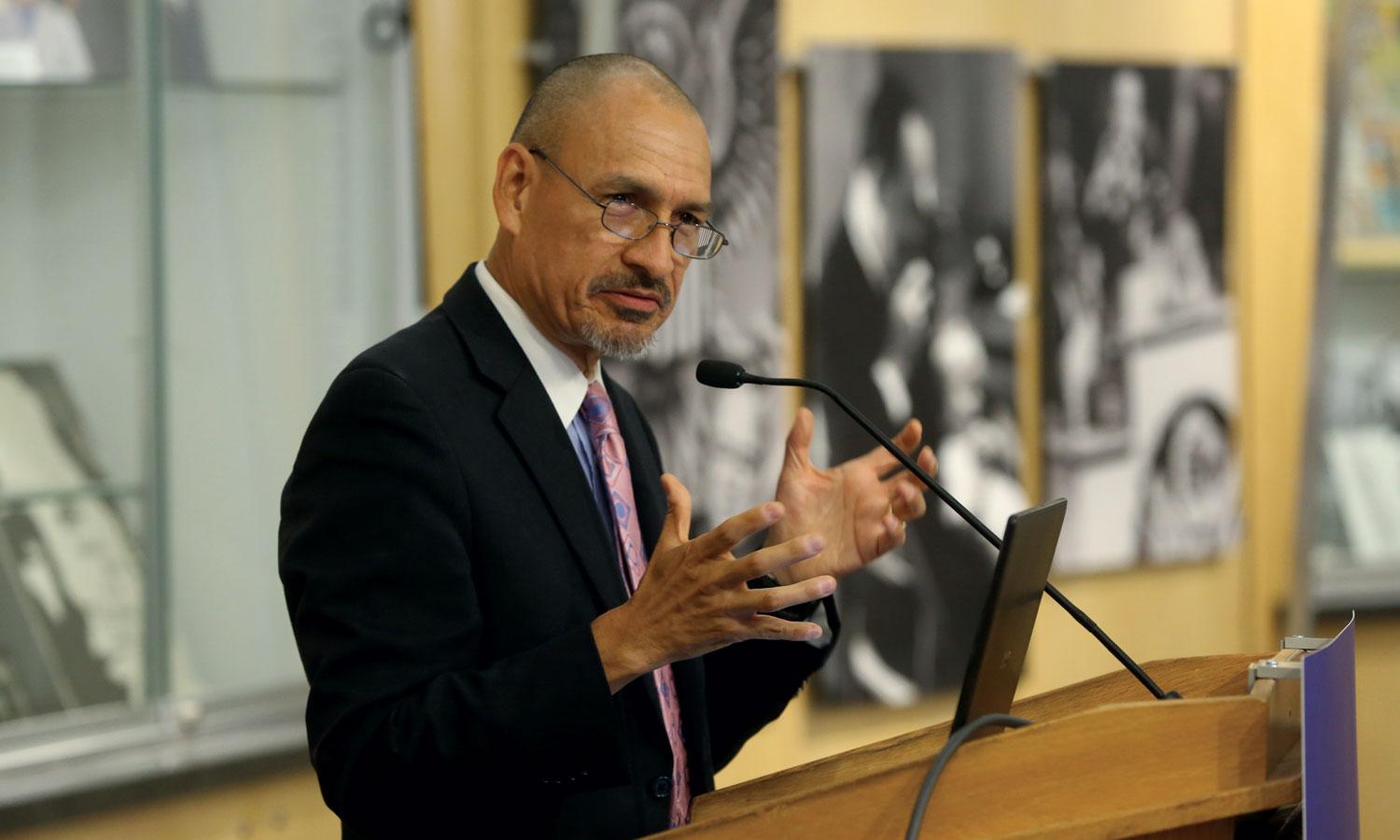 Scientist speaking at a public event