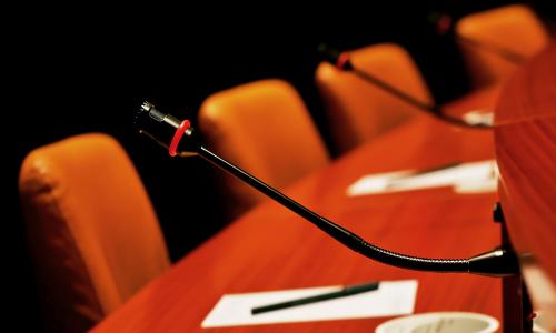 Conference table with empty chairs