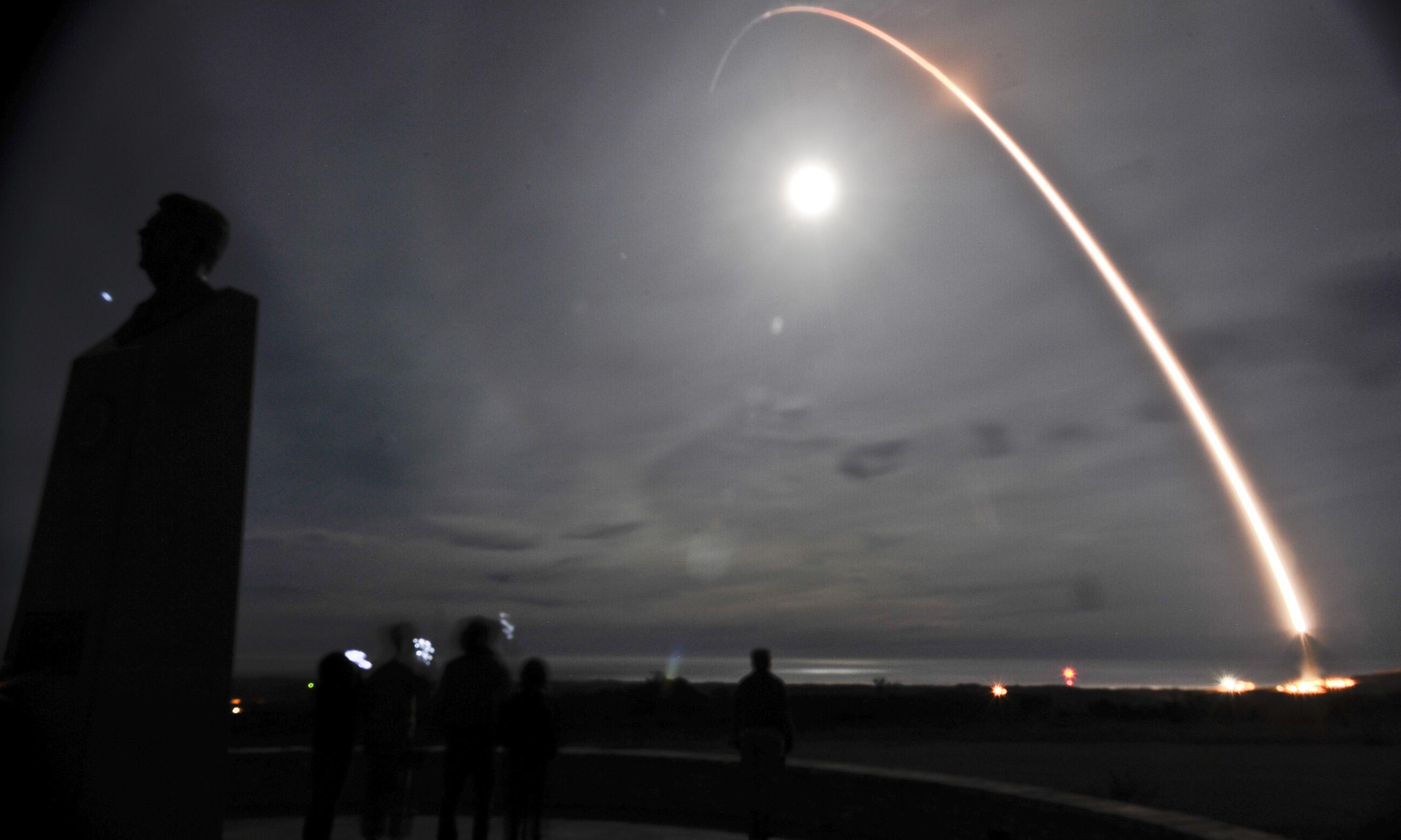 A missile being launched at night