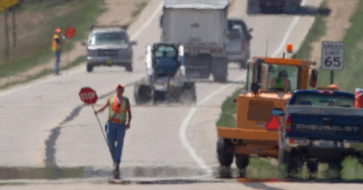 worker in hot roadway