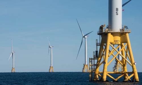 Four offshore wind turbines. 