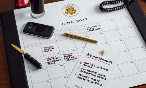 A desk planner showing Trump's anti-science agenda