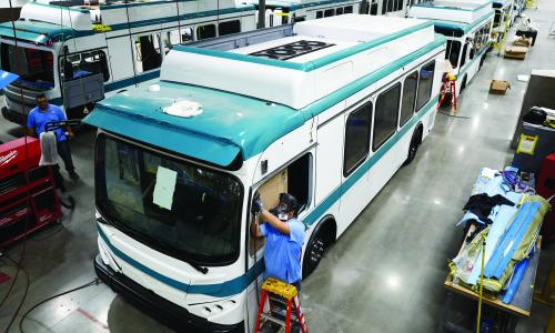 Workers construct electric buses