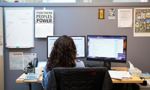 A UCS staff person at desk