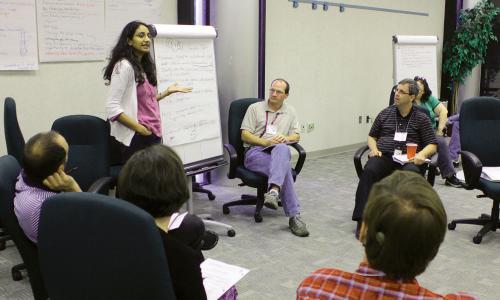 Woman giving flipboard presentation at a meeting